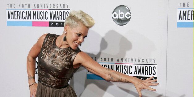 Singer Pink poses as she arrives at the 40th American Music Awards in Los Angeles, California, November 18, 2012. REUTERS/Jonathan Alcorn (UNITED STATES - Tags: ENTERTAINMENT PORTRAIT) (AMA-ARRIVALS)