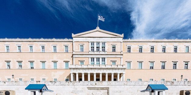 The greek Hellenic Parliament Building under blue summer sky. Athens, Greece.