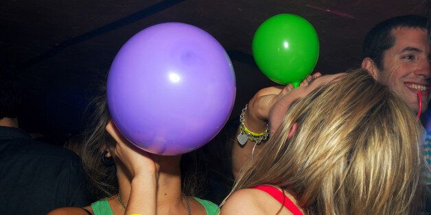Two women with laughing gas balloons, Secret Sanchez, Secret Location Bristol, UK 2007. (Photo by: PYMCA/UIG via Getty Images)