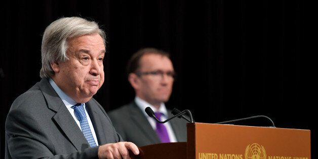 UN Secretary General Antonio Guterres (L) speaks during a press conference flanked by Special Adviser of the UN Secretary-General on Cyprus, Norvegian Espen Barth Eide (rear C) during peace talks on June 30, 2017 in the Swiss resort of Crans-Montana.More than 40 years after Turkish troops invaded northern Cyprus, the presence of tens of thousands of soldiers on the Mediterranean island still looms large over make-or-break peace negotiations this week. / AFP PHOTO / Fabrice COFFRINI (Photo