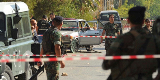 Lebanese army soldiers and policemen secure the area at the site where suicide bomb attacks took place in the Christian village of Qaa, in the Bekaa valley, Lebanon June 27, 2016. REUTERS/Hassan Abdallah