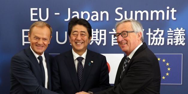 European Council President Donald Tusk (L), Japanese Prime Minister Shinzo Abe (C) and President of Commission Jean-Claude Juncker pose for a picture at the European Council on July 6, 2017 in BrusselsJapanese Prime Minister Shinzo Abe and the EU's top officials will join forces and approve the broad outline of a landmark trade deal that would challenge the protectionism championed by US President. / AFP PHOTO / POOL / Francois Walschaerts (Photo credit should read FRANCOIS WALSCHAERTS/AFP/Getty Images)