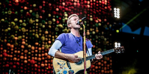 MILAN, ITALY - JULY 03: Chris Martin of British rock band Coldplay performs on stage at Stadio San Siro on July 3, 2017 in Milan, Italy. (Photo by Sergione Infuso/Corbis via Getty Images)