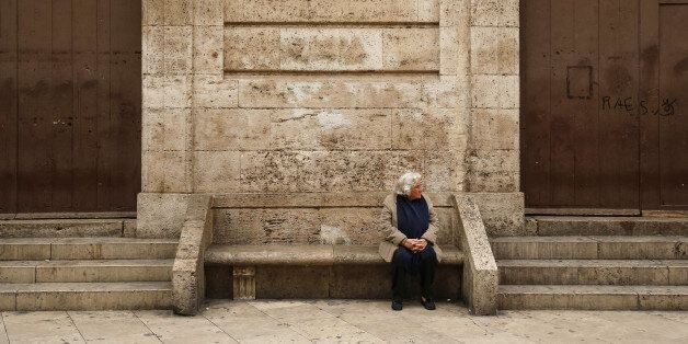 A pensioner rests on a bench in Valencia, Spain, on Monday, Nov. 21, 2016. Christmas is providing a boost for thousands of Spanish jobseekers as retailers increase their seasonal staff to meet renewed demand from shoppers enjoying the economic recovery. Photographer: Pau Barrena/Bloomberg via Getty Images