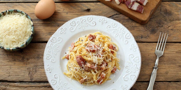 top view tagliatelli carbanara italian cuisine on plate rustic kitchen table background