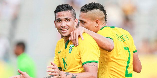 HAMILTON, CANADA, JULY 20: Luciano Da Rocha Neves of Brazil celebrates with his teammate Gilberto Moraes Junior after scoring a goal during a match between Brazil and Panama as part of Toronto 2015 Pan Am Games at Tim Hortons Field Stadium on July 20, 2015 in Hamilton, Canada. (Photo by William Volcov/Brazil Photo Press/LatinContent/Getty Images)