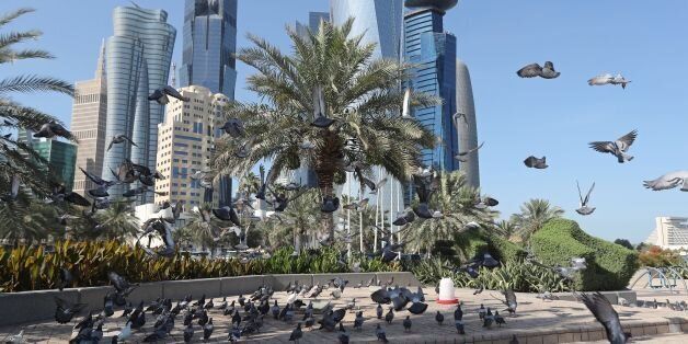 A general view taken on June 5, 2017 shows pigeons flying above the corniche in Doha. Arab nations including Saudi Arabia and Egypt cut ties with Qatar, accusing it of supporting extremism, in the biggest diplomatic crisis to hit the region in years. / AFP PHOTO / STR (Photo credit should read STR/AFP/Getty Images)