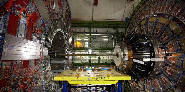 A technician stands near equipment of the Compact Muon Solenoid (CMS) experience at the Organization for Nuclear Research (CERN) in the French village of Cessy, France, near Geneva in Switzerland April 15, 2013. To match Interview SCIENCE-CERN/ REUTERS/Denis Balibouse/File Photo