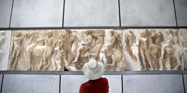 A man looks at exhibits at the Parthenon hall of the Acropolis museum in Athens, Greece, May 18, 2015. REUTERS/Alkis Konstantinidis/File Photo