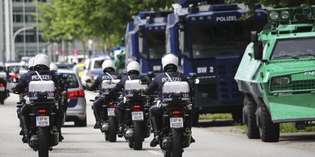 Austrian police officers ride on motorbikes ahead of the G20 summit in Hamburg, Germany, July 5, 2017. REUTERS/Kai Pfaffenbach