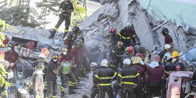 TORRE ANNUNZIATA, CAMPANIA, ITALY - 2017/07/07: Volunteers in the ruins of the palace of Torre Annunziata, near Naples, southern Italy, suddenly collapsed. At the early lights of the morning, a five-story palace suddenly collapsed, burying several people. (Photo by Salvatore Laporta/KONTROLAB /LightRocket via Getty Images)