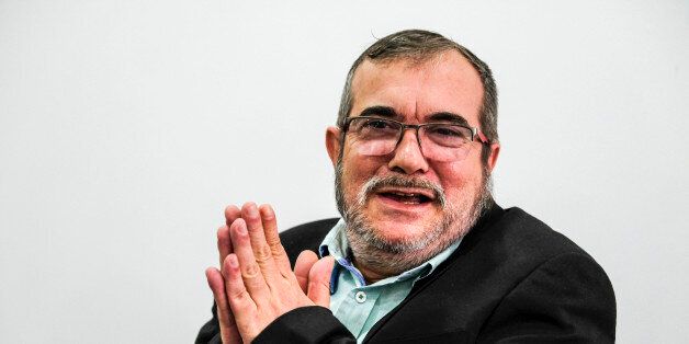 The head of the FARC guerrilla Timoleon Jimenez, aka Timochenko, gestures during a press conference in Bogota on November 25, 2016.Colombia's government and FARC rebels signed a controversial revised peace accord Thursday to end their half-century conflict, set to be ratified in Congress despite bitter opposition. / AFP / Juan Jose Horta (Photo credit should read JUAN JOSE HORTA/AFP/Getty Images)
