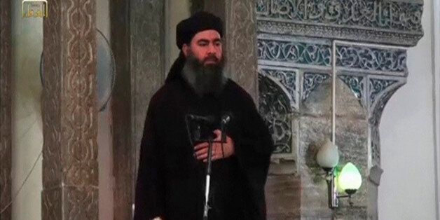 A man purported to be the reclusive leader of the militant Islamic State Abu Bakr al-Baghdadi has made what would be his first public appearance at a mosque in the centre of Iraq's second city, Mosul, according to a video recording posted on the Internet on July 5, 2014, in this still image taken from video. There had previously been reports on social media that Abu Bakr al-Baghdadi would make his first public appearance since his Islamic State in Iraq and the Levant (ISIL) changed its name to the Islamic State and declared him caliph. The Iraqi government denied that the video, which carried Friday's date, was credible. It was also not possible to immediately confirm the authenticity of the recording or the date when it was made. REUTERS/Social Media Website via Reuters TV (IRAQ - Tags: POLITICS) ATTENTION EDITORS - THIS IMAGE HAS BEEN SUPPLIED BY A THIRD PARTY. IT IS DISTRIBUTED, EXACTLY AS RECEIVED BY REUTERS, AS A SERVICE TO CLIENTS. REUTERS IS UNABLE TO INDEPENDENTLY VERIFY THE CONTENT OF THIS VIDEO, WHICH HAS BEEN OBTAINED FROM A SOCIAL MEDIA WEBSITE