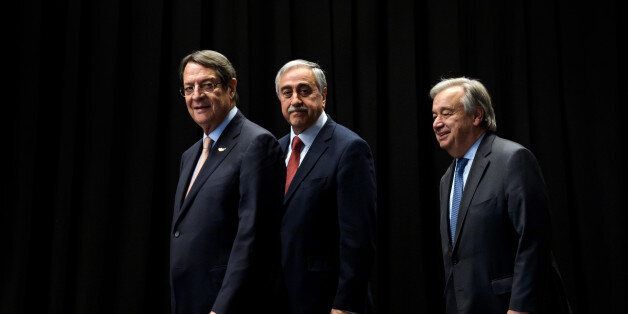 (L/R): Greek Cypriot President Nicos Anastasiades, Turkish Cypriot Leader Mustafa Akinci and UN Secretary General Antonio Guterres arrive for a photograph during Cyprus peace talks in the Swiss resort of Crans-Montana on June 30, 2017.More than 40 years after Turkish troops invaded northern Cyprus, the presence of tens of thousands of soldiers on the Mediterranean island still looms large over make-or-break peace negotiations this week. / AFP PHOTO / Fabrice COFFRINI (Photo credit should