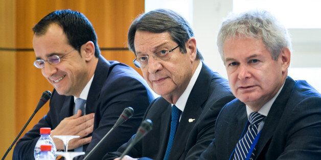 Greek Cypriot President Nicos Anastasiades (C) looks on at the opening of Cyprus peace talks on June 28, 2017 in the Swiss resort of Crans-Montana.Rival Cypriot leaders meet to resume efforts to solve one of the world's longest-running political crises in what the island's UN envoy billed as the 'best chance' for peace. The make-or-break talks in Switzerland are geared towards ending the decades-old division of the island and striking a lasting deal between its Greek- and Turkish-speaking communities. / AFP PHOTO / Fabrice COFFRINI (Photo credit should read FABRICE COFFRINI/AFP/Getty Images)