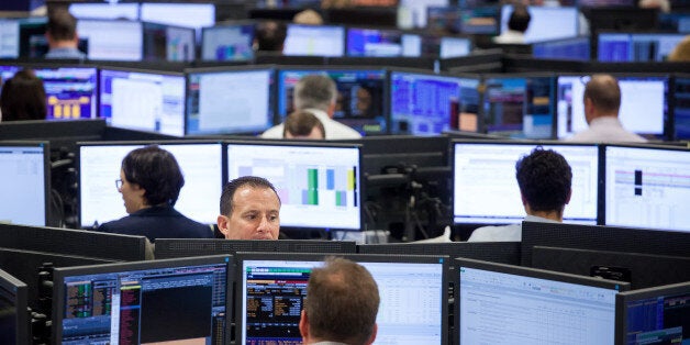 Traders work on the Mizuho Americas trading floor in New York, U.S., on Wednesday, April 26, 2017. Mizuho Financial Group Inc. is seeking to boost its presence in Yankee bonds -- dollar-denominated bonds issued in the U.S. by foreign entities -- in a bid to tap into its global network and boost fee income from some of Asia and Europe's largest companies. Photographer: Michael Nagle/Bloomberg via Getty Images