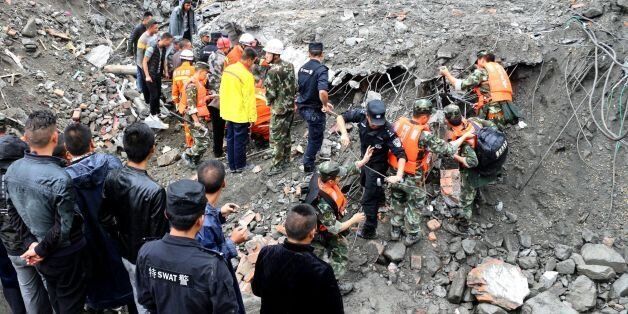 MAOXIAN, CHINA - JUNE 24: Rescuers work on the site of a massive landslide where over 120 villagers are estimated buried in the early morning disaster on June 24, 2017 in Maoxian, China.Six bodies have been found so far.PHOTOGRAPH BY Feature China / Barcroft ImagesLondon-T:+44 207 033 1031 E:hello@barcroftmedia.com -New York-T:+1 212 796 2458 E:hello@barcroftusa.com -New Delhi-T:+91 11 4053 2429 E:hello@barcroftindia.com www.barcroftimages.com (Photo credit should read Feature China / Barcroft Images / Barcroft Media via Getty Images)