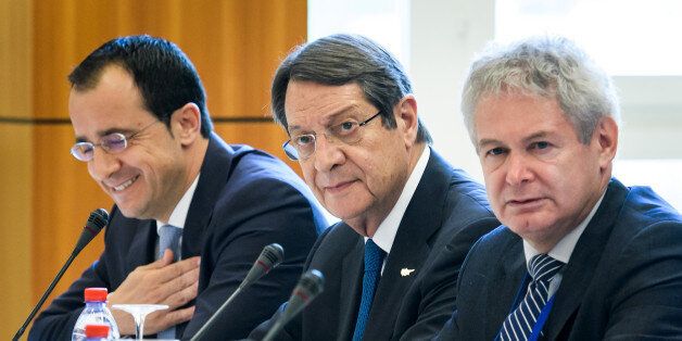Greek Cypriot President Nicos Anastasiades (C) looks on at the opening of Cyprus peace talks on June 28, 2017 in the Swiss resort of Crans-Montana.Rival Cypriot leaders meet to resume efforts to solve one of the world's longest-running political crises in what the island's UN envoy billed as the 'best chance' for peace. The make-or-break talks in Switzerland are geared towards ending the decades-old division of the island and striking a lasting deal between its Greek- and Turkish-speaking communities. / AFP PHOTO / Fabrice COFFRINI (Photo credit should read FABRICE COFFRINI/AFP/Getty Images)