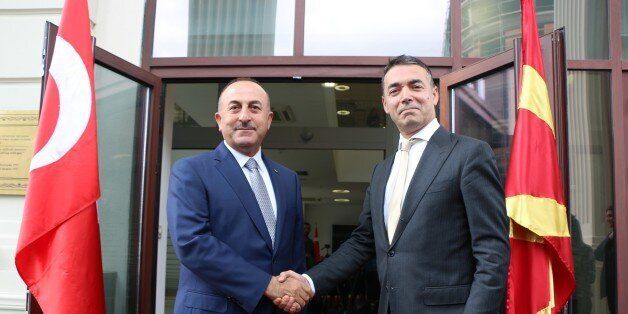 SKOPJE, MACEDONIA - JUNE 18 : Foreign Minister of Turkey Mevlut Cavusoglu (L) is welcomed by his Macedonian counterpart Nikola Dimitrov (R) ahead of their meeting in Skopje, Macedonia on June 18, 2017. (Photo by Besar Ademi/Anadolu Agency/Getty Images)