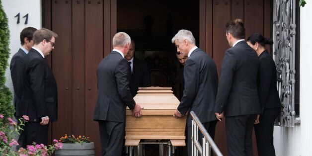 A coffin is being wheeled off the house of late former German Chancellor Helmut Kohl in Oggersheim near Ludwigshafen, western Germany, on June 22, 2017.Helmut Kohl, the former German chancellor who seized the chance to reunite his country after years of Cold War separation, died at the age of 87 on June 16, 2017. / AFP PHOTO / dpa / Andreas Arnold / Germany OUT (Photo credit should read ANDREAS ARNOLD/AFP/Getty Images)