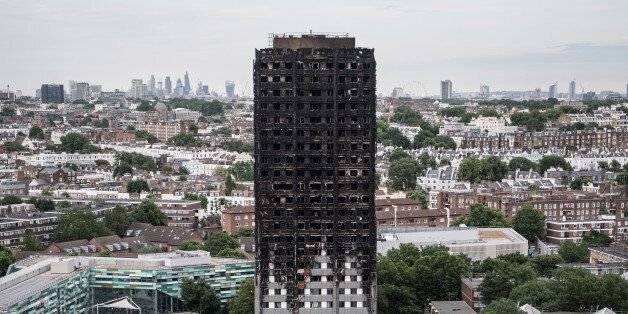 LONDON, ENGLAND - JUNE 26: The remains of Grenfell Tower are seen from a neighbouring tower block on June 26, 2017 in London, England. 79 people have been confirmed dead and dozens still missing after the 24 storey residential Grenfell Tower block was engulfed in flames in the early hours of June 14, 2017. (Photo by Carl Court/Getty Images)