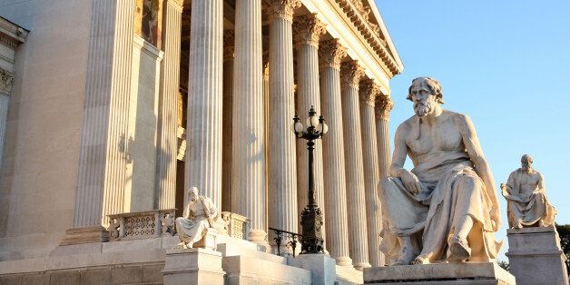 The Austrian Parliament with statue philosopher Thucydides in Vienna, Austria