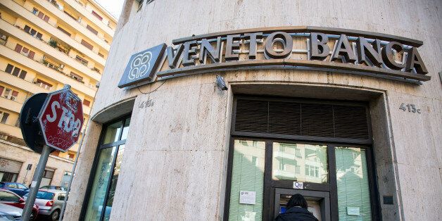 A customer uses an automated teller machine (ATM) at a Veneto Banca SpA bank branch in Rome, Italy, on Friday, Dec. 23, 2016. The nationalization of Banca Monte dei Paschi di Siena SpA could be followed by rescues for lenders including Veneto Banca SpA and Banca Popolare di Vicenza as part of the government package. Photographer: Alessia Pierdomenico/Bloomberg via Getty Images