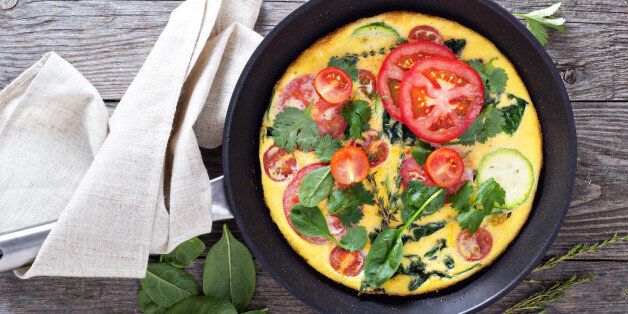 Fresh fritatta with zucchini, spinach and tomatoes