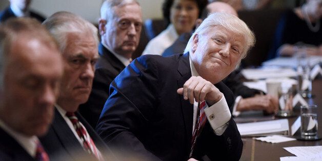 U.S. President Donald Trump smiles during a meeting with Cabinet members at the White House in Washington, D.C., U.S., on Monday, June 12, 2017. U.S. Attorney GeneralÂ Jeff SessionsÂ will testify publicly Tuesday before the Senate Intelligence Committee, a high-stakes event that comes days after fired FBI DirectorÂ James Comey'sÂ dramatic appearance. Photographer: Olivier Douliery/Pool via Bloomberg