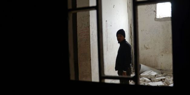Khalifah al-Khidr, a Syrian who was held captive in an Islamic State (IS) group prison in the northern Syrian town of al-Bab from June 2014 until his escape in December 2014, revisits one of the prison cells on March 2, 2017 after Turkish-backed rebels announced the recapture of the town from IS. / AFP PHOTO / Nazeer al-Khatib (Photo credit should read NAZEER AL-KHATIB/AFP/Getty Images)