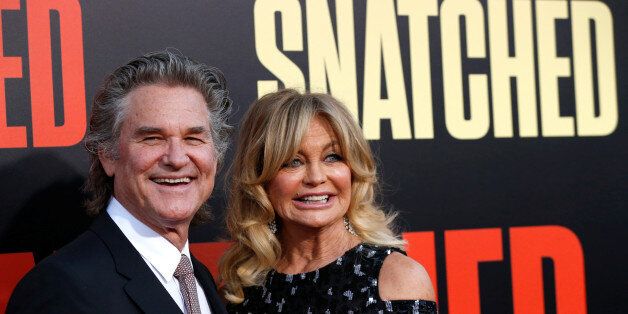Cast member Goldie Hawn and actor Kurt Russell pose at the premiere of the movie