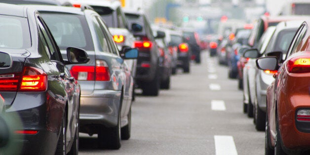 Cars in long row on highway in traffic jam