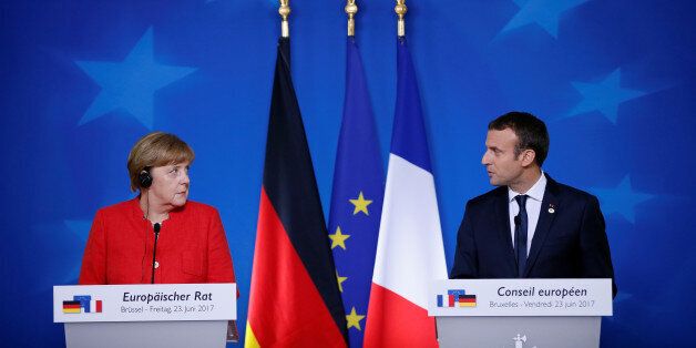 German Chancellor Angela Merkel and French President Emmanuel Macron addresses a joint news conference at the EU summit in Brussels, Belgium, June 23, 2017. REUTERS/Gonzalo Fuentes TPX IMAGES OF THE DAY