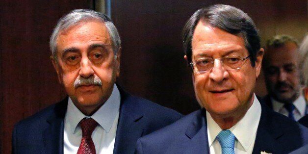 Greek Cypriot leader Nicos Anastasiades (R) and Turkish Cypriot leader Mustafa Akinci (L) arrive to attend a meeting with UN Secretary-General Antonio Guterres on June 4, 2017 at UN Headquarters in New York. / AFP PHOTO / Kena Betancur (Photo credit should read KENA BETANCUR/AFP/Getty Images)