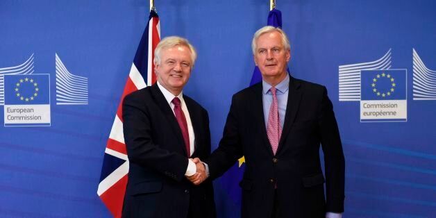 Britain's Secretary of State for Exiting the European Union (Brexit Minister) David Davis (L) and European Commission member in charge of Brexit negotiations with Britain, Michel Barnier shake hands at the European Commission in Brussels on June 19, 2017, as Britain starts formal talks to leave the EU.Britain starts formal talks to leave the EU on Monday, seeking a deal 'like no other in history' despite entering fiendishly difficult negotiations with a badly weakened government. / AFP PHOTO / JOHN THYS (Photo credit should read JOHN THYS/AFP/Getty Images)
