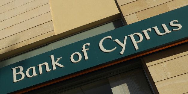 NICOSIA, CYPRUS - MARCH 05: A local branch of Bank of Cyprus stands on March 5, 2017 in Nicosia, Cyprus. Several U.S. Democratic senators are claiming the White House is blocking a statement by newly-confirmed U.S. Commerce Secretary Wilbur Ross over possible ties, including any loans, between U.S. President Donald Trump, the Trump Organization and any Trump election campaign associates to the bank. Ross is a former executive at Bank of Cyprus and helped prop up the once-ailing bank with an investment of EUR 400 million. Other investors in the bank include Vladimir Strzhalkovsky and Viktor Vekselberg, both of whom have ties to Russian President Vladimir Putin. (Photo by Sean Gallup/Getty Images)