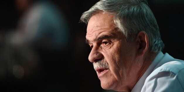 Greek Deputy Minister of Public Order and Citizen Protection Nikos Toskas speaks during an interview with AFP in Athens on November 26, 2015. The 'arbitrary' filtering by some countries of the passage of migrants in Europe is against 'EU principles,' Toskas told AFP, referring particularly to the situation at the border with Macedonia. Over 200 migrants tried to break through barbed wire fences to cross from Greece into Macedonia, which imposed new border restrictions last week, throwing stones at police, AFP reporters said. AFP PHOTO / LOUISA GOULIAMAKI / AFP / LOUISA GOULIAMAKI (Photo credit should read LOUISA GOULIAMAKI/AFP/Getty Images)