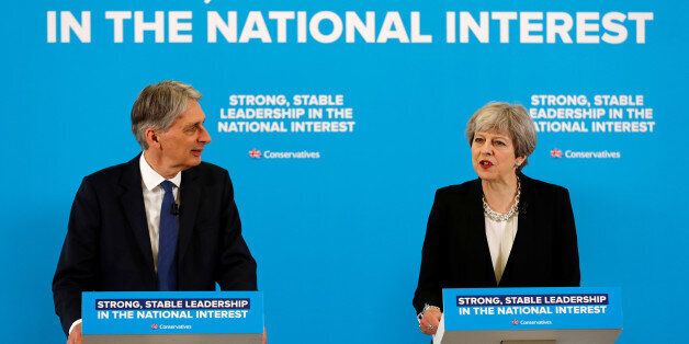 Britain's Prime Minister Theresa May and Chancellor of the Exchequer Philip Hammond attend a news conference in London's Canary Wharf financial district, May 17, 2017. REUTERS/Stefan Wermuth