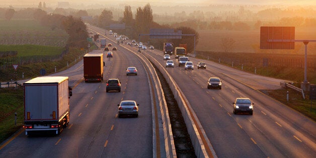 Traffic on highway with cars.