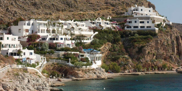 Europe, Greece, Tilos Island, View Of Port. Most Inhabited Greek Islands Are Connected To Either Larger Islands (With Hospitals And Airports), Or To The Capital By Ferry Boats. Depending On The Season, Weather And Size, The Frequency Varies From Daily To Weekly. Breaking A Leg On Small Island On The Wrong Day Could Require A Wait Of A Week For A Boat To Carry The Injured To A Hospital.