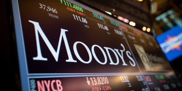 A monitor displays Moody's Corp. signage on the floor of the New York Stock Exchange (NYSE) in New York, U.S., on Monday, March 27, 2017. U.S. stocks fell, extending a decline on Friday after President Trump failed to pass his health-care bill, undermining optimism he can enact growth policies that invigorated bulls after the election. Photographer: Michael Nagle/Bloomberg via Getty Images