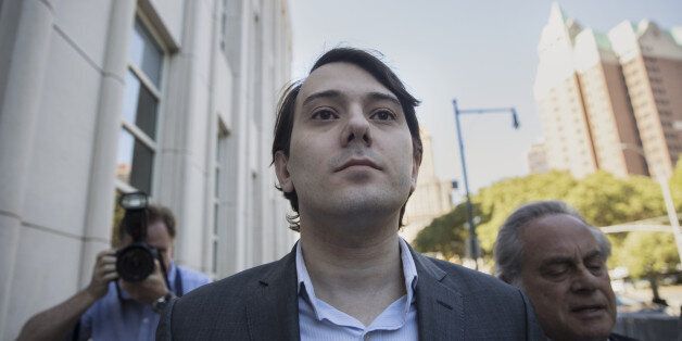 Martin Shkreli, former chief executive officer of Turing Pharmaceuticals AG, center, arrives at federal court with his attorney Benjamin Brafman in the Brooklyn borough of New York, U.S., on Monday, June 26, 2017. Federal prosecutors accuse Shkreli of using $11 million in stock from Retrophin Inc. to pay off investors who lost money in two of his funds. In announcing the case,Â Robert Capers, then the U.S. Attorney in Brooklyn, said Shkreli ran his companies 'like a Ponzi scheme.' He has pleaded not guilty. Photographer: Victor J. Blue/Bloomberg via Getty Images