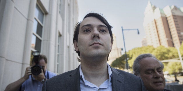 Martin Shkreli, former chief executive officer of Turing Pharmaceuticals AG, center, arrives at federal court with his attorney Benjamin Brafman in the Brooklyn borough of New York, U.S., on Monday, June 26, 2017. Federal prosecutors accuse Shkreli of using $11 million in stock from Retrophin Inc. to pay off investors who lost money in two of his funds. In announcing the case, Robert Capers, then the U.S. Attorney in Brooklyn, said Shkreli ran his companies 'like a Ponzi scheme.' He has pleaded not guilty. Photographer: Victor J. Blue/Bloomberg via Getty Images