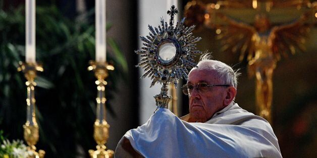Pope Francis celebrates the Corpus Domini after a procession from St. John at the Lateran Basilica to St. Mary Major Basilica to mark the feast of the Body and Blood of Christ, on June 18, 2017 in Rome. / AFP PHOTO / Vincenzo PINTO (Photo credit should read VINCENZO PINTO/AFP/Getty Images)