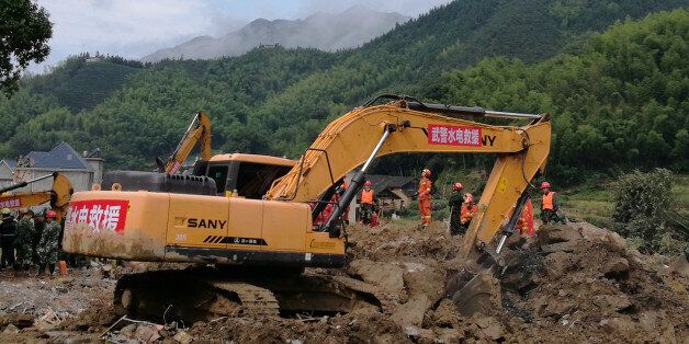 SUICHANG, CHINA - SEPTEMBER 30: Rescue workers search for missing people after the massive landslide on September 30, 2016 in Suichang, China.Fifteen people were rescued, four bodies were found, and another 23 are still missing.PHOTOGRAPH BY Feature China / Barcroft Images London-T:+44 207 033 1031 E:hello@barcroftmedia.com - New York-T:+1 212 796 2458 E:hello@barcroftusa.com - New Delhi-T:+91 11 4053 2429 E:hello@barcroftindia.com www.barcroftimages.com (Photo credit should read Feature China / Barcroft Images / Barcroft Media via Getty Images)