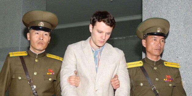 Otto Frederick Warmbier (C), a University of Virginia student who was detained in North Korea since early January, is taken to North Korea's top court in Pyongyang, North Korea, in this photo released by Kyodo March 16, 2016. North Korea's supreme court sentenced American student Warmbier, who was arrested while visiting the country, to 15 years of hard labour for crimes against the state, China's Xinhua news agency reported on Wednesday. Mandatory credit REUTERS/Kyodo Mandatory credit REUTERS/Kyodo ATTENTION EDITORS - THIS IMAGE HAS BEEN SUPPLIED BY A THIRD PARTY. FOR EDITORIAL USE ONLY. NOT FOR SALE FOR MARKETING OR ADVERTISING CAMPAIGNS. MANDATORY CREDIT. JAPAN OUT. NO COMMERCIAL OR EDITORIAL SALES IN JAPAN. TPX IMAGES OF THE DAY