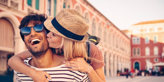 Shot of a young man piggybacking his girlfriend through a foreign cityhttp://195.154.178.81/DATA/i_collage/pu/shoots/805861.jpg