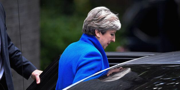 LONDON, ENGLAND - JUNE 09: Britain's Prime Minister and leader of the Conservative Party Theresa May leaves 10 Downing Street en route to Buckingham Palace to meet Queen Elizabeth II, the day after a general election on June 9, 2017 in London, England. After a snap election was called by Prime Minister Theresa May the United Kingdom went to the polls yesterday. The closely fought election has failed to return a clear overall majority winner and a hung parliament has been declared. (Photo by Jeff J Mitchell/Getty Images)