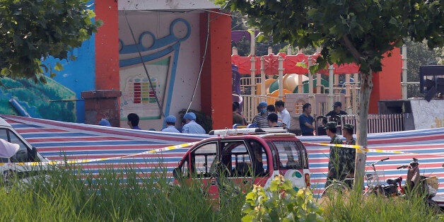 Investigators work at the scene of an explosion inside a kindergarten in Fengxian County in Jiangsu Province, China June 16, 2017. REUTERS/Aly Song