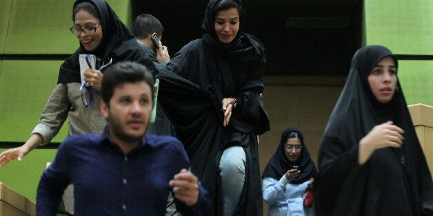 Women are seen inside the parliament during an attack in central Tehran, Iran, June 7, 2017. TIMA via REUTERS ATTENTION EDITORS - THIS IMAGE WAS PROVIDED BY A THIRD PARTY. FOR EDITORIAL USE ONLY.